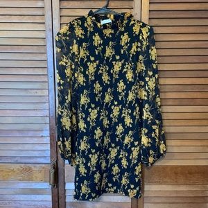 Beautiful black and orange dress stretchy with blouse see-through sleeves